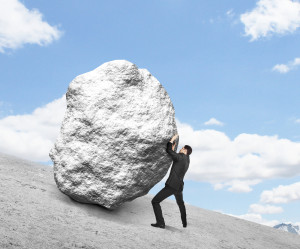 bigstock-Businessman-Pushing-Stone-54105938